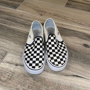 Size 8.5 womens checkered vans. In decent condition.